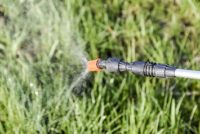 Sprayer treating grass with glyphosate