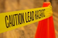 Caution tape warning of lead abatement hazard